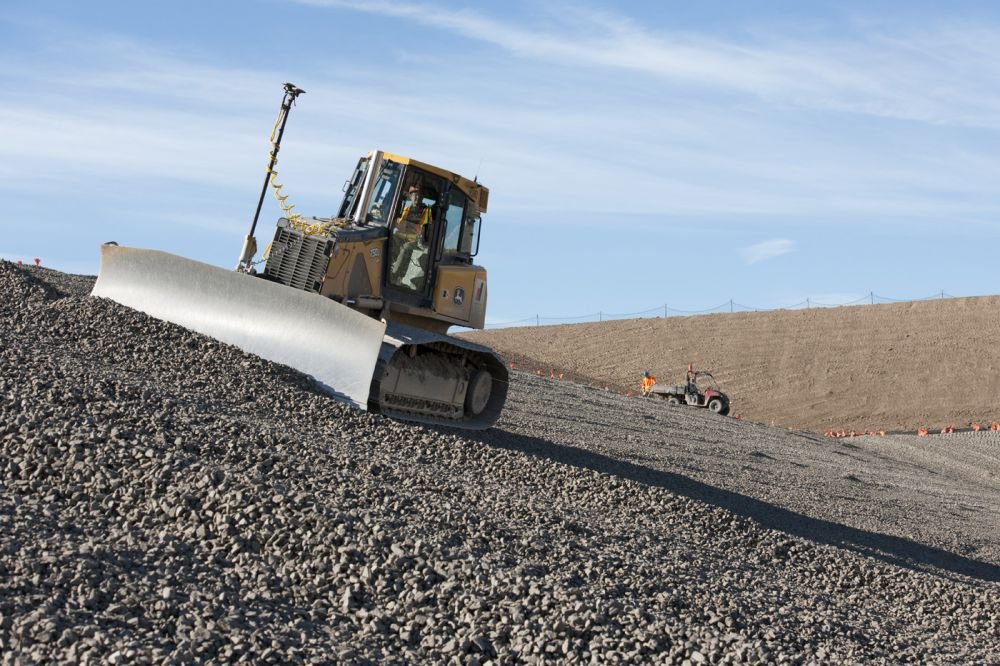 Dozer grading a mound.